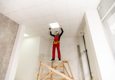 Builder replacing ceiling panel, working, ceiling armstrong Builder replacing ceiling panel, working, ceiling armstrong
