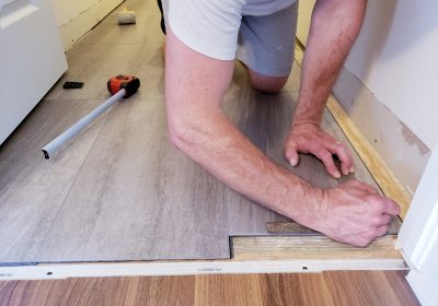Floor level view of laminate flooring installation, home renovation, construction materials, tiles Floor level view of laminate flooring installation, home renovation, construction materials, tiles